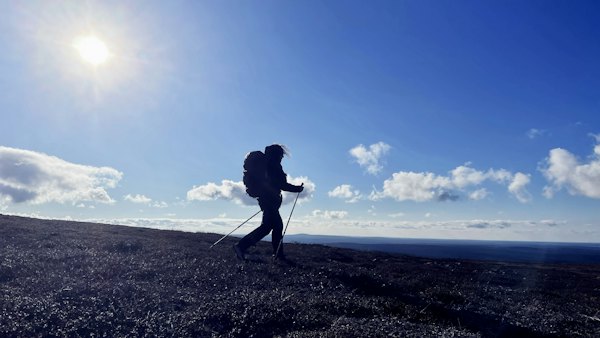 A hiker on the open fells of Urho Kekkonen National Park — Saariselkä, Finland