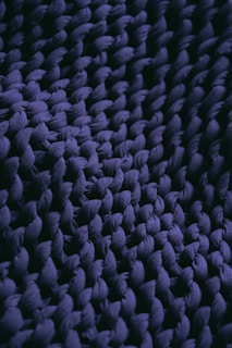a close up view of a purple rug