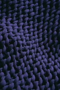 a close up view of a purple rug