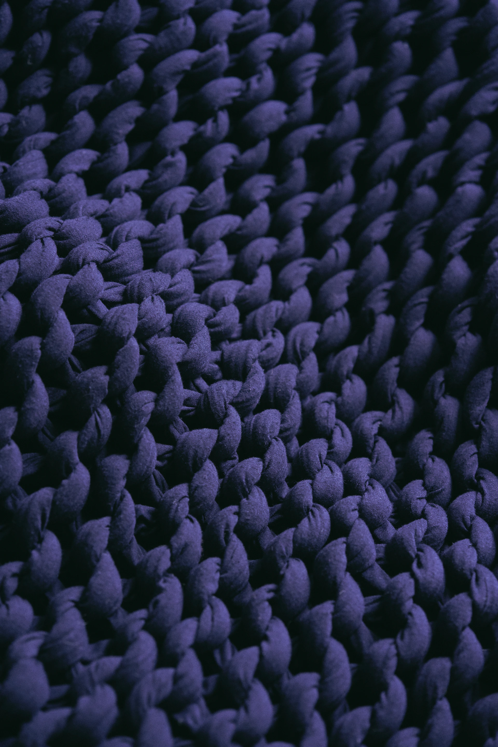 a close up view of a purple rug