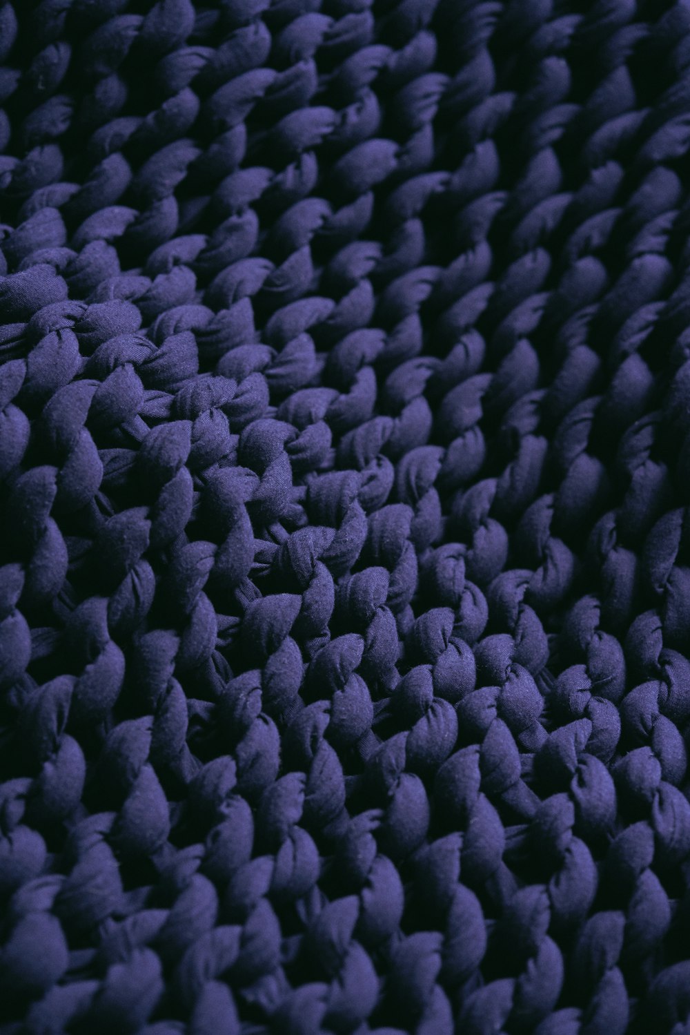 a close up view of a purple rug