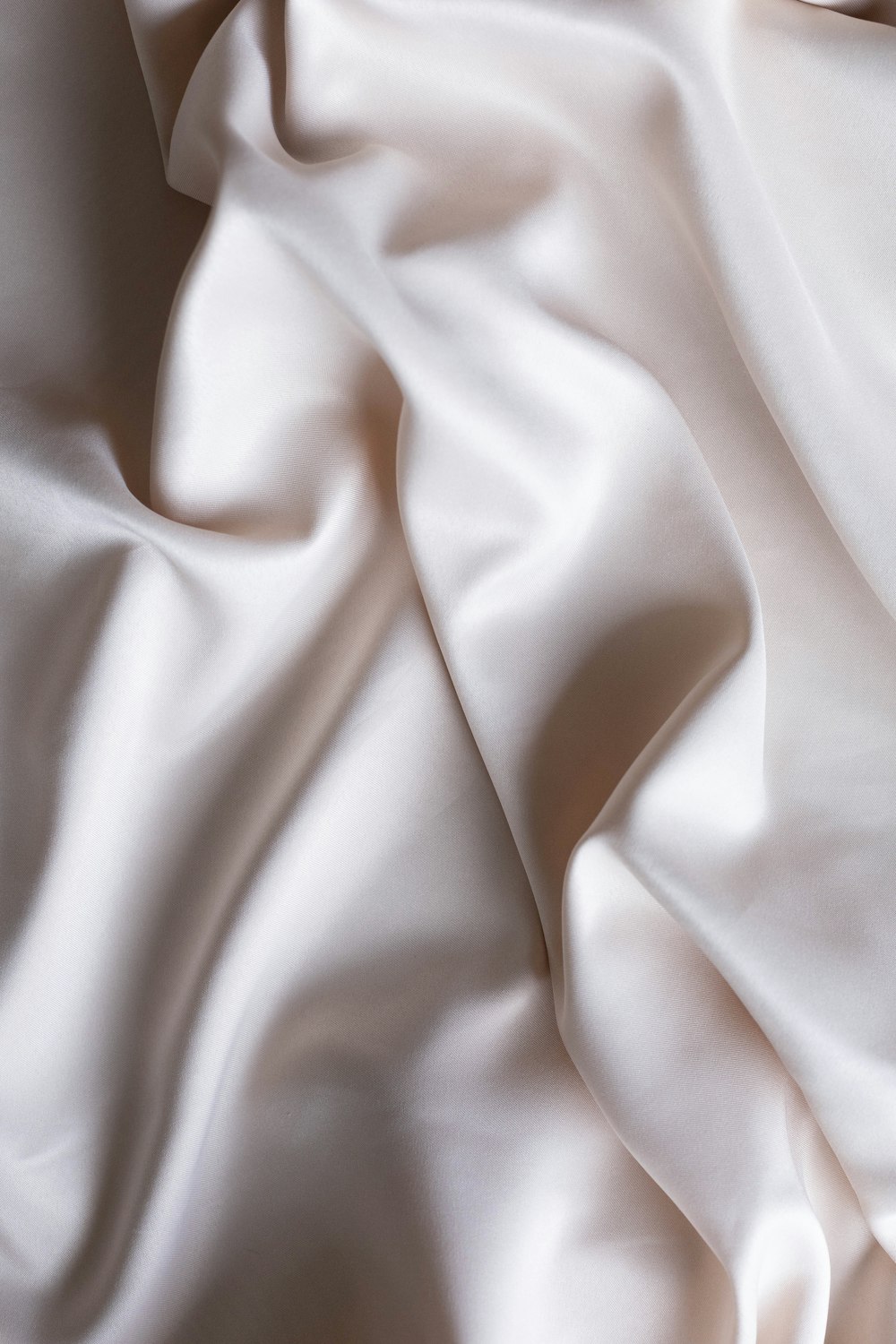 a close up of a white satin fabric