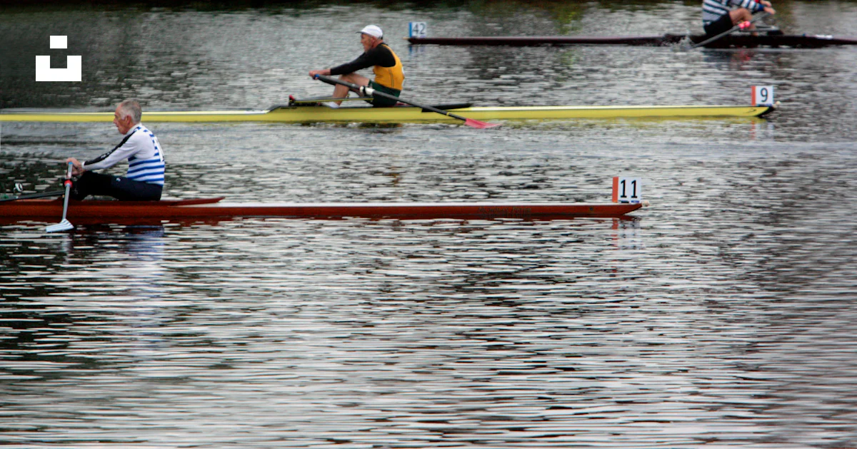 A group of people rowing on a body of water photo – Free Ma Image on ...