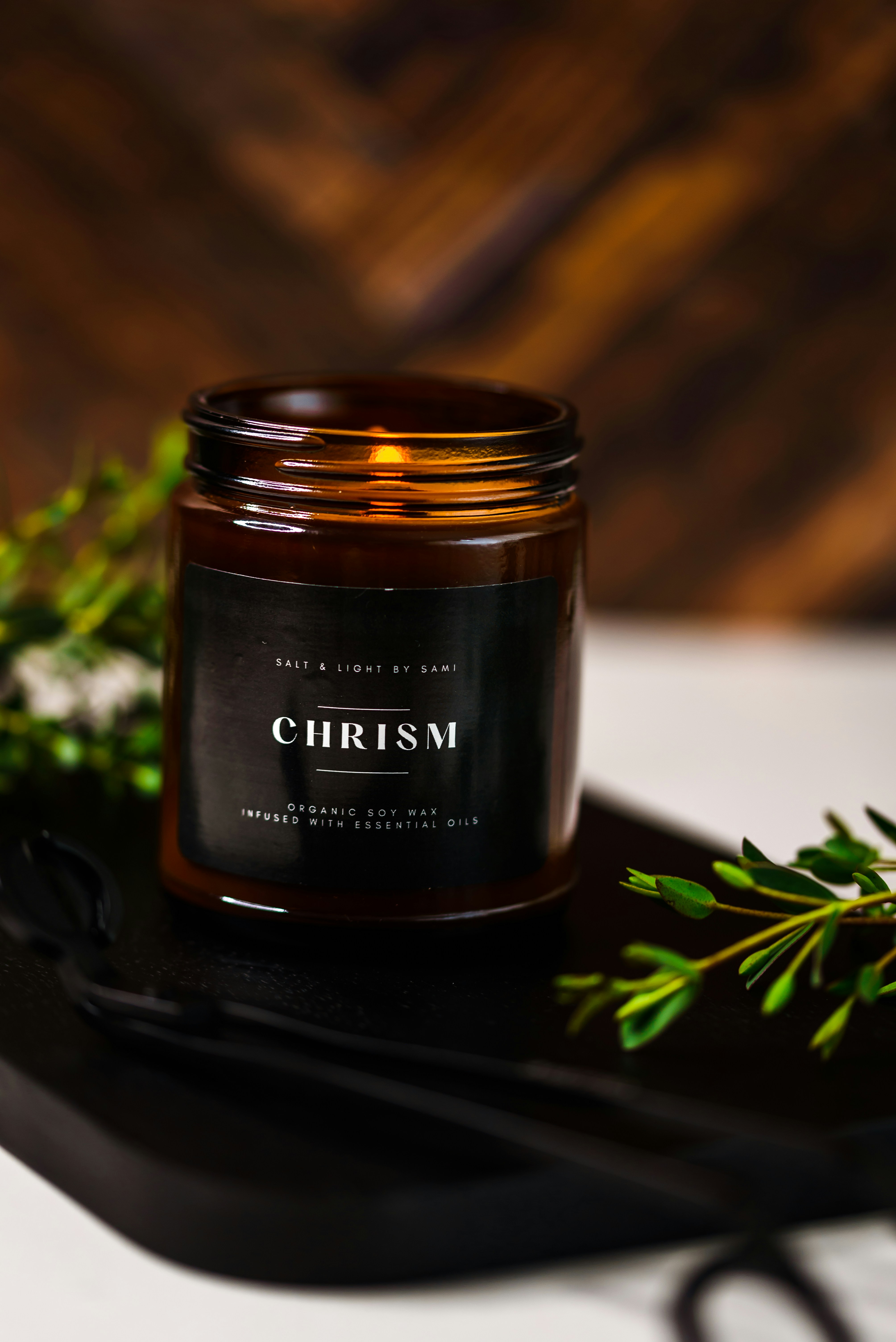 a candle sitting on top of a black tray