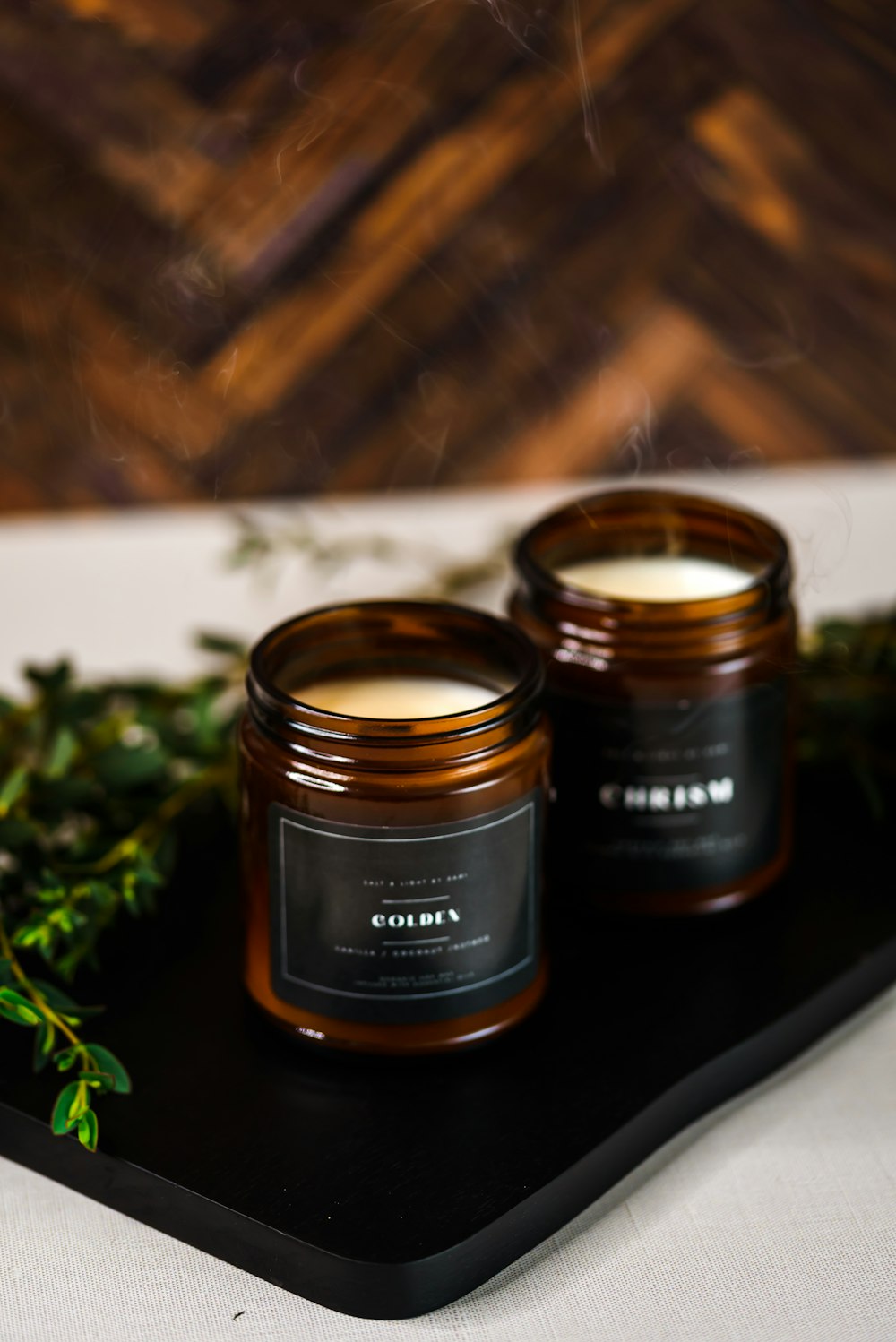 a couple of candles sitting on top of a tray