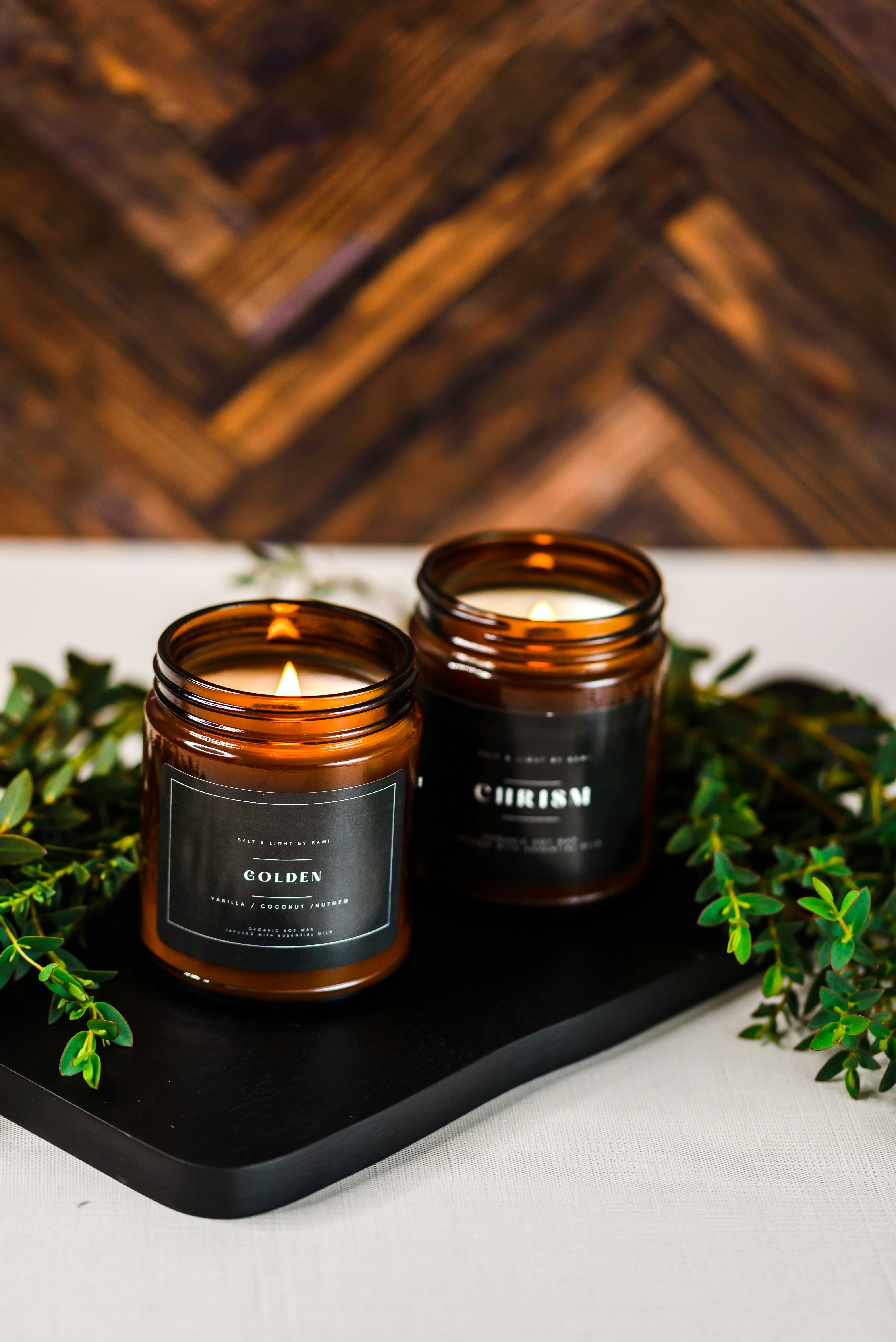 a couple of candles sitting on top of a tray