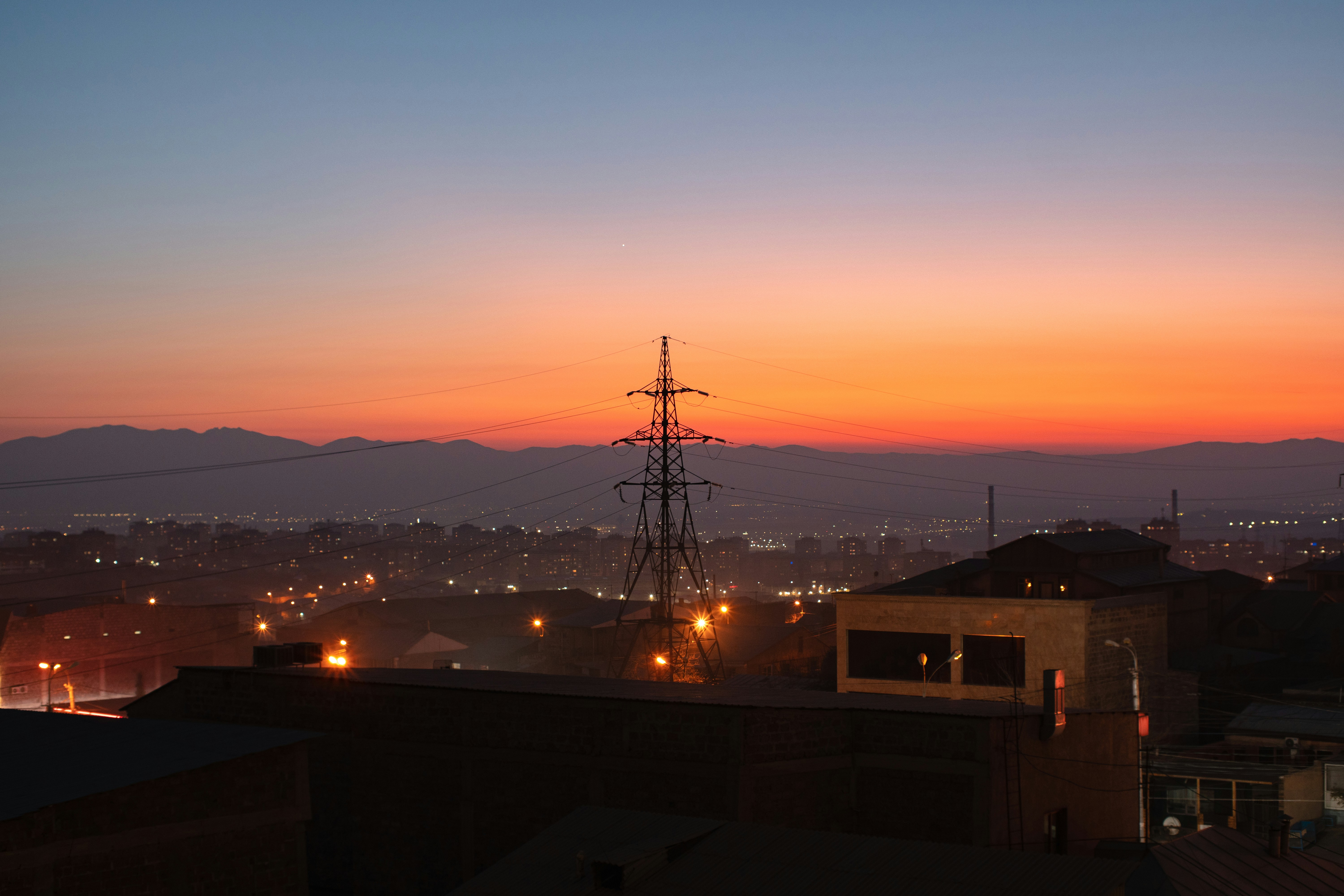 a view of a city at night from a rooftop