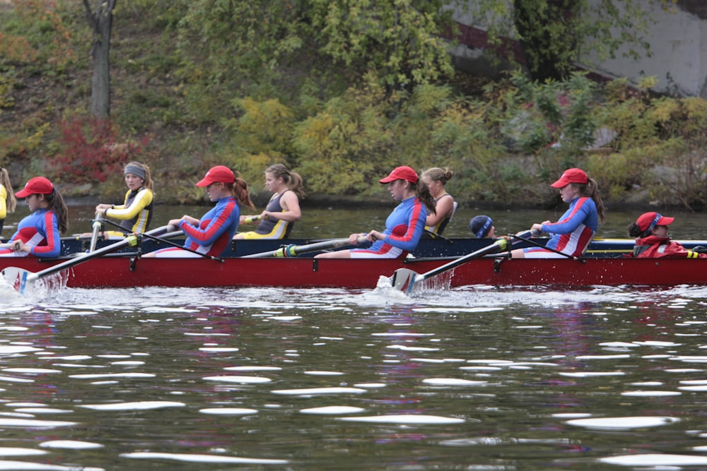 a group of people riding on the back of a boat