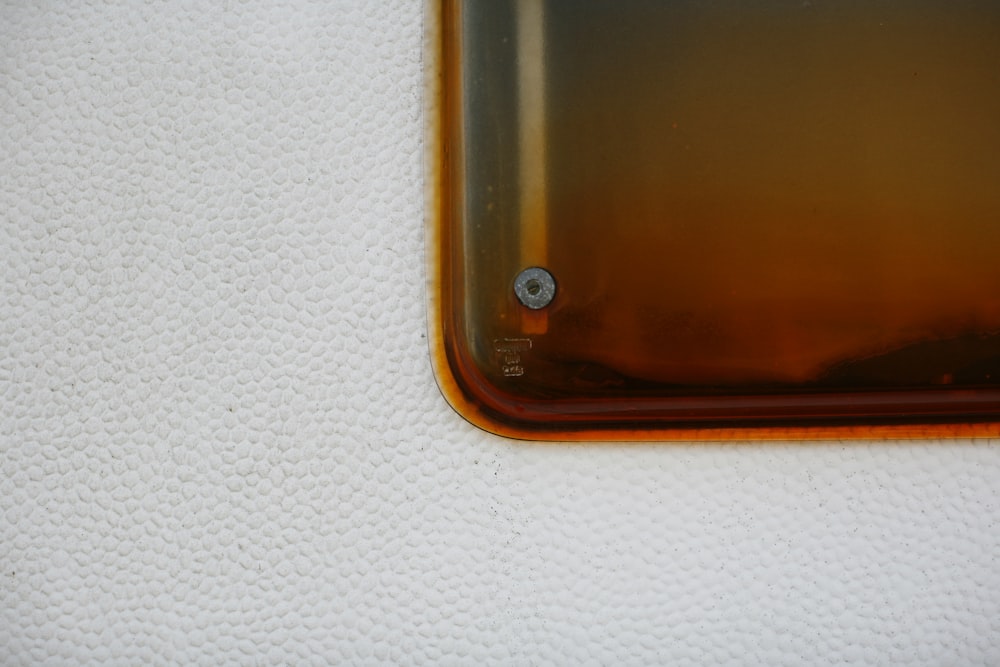 a close up of a glass object on a white surface