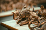 a close up of an elephant figurine on a table