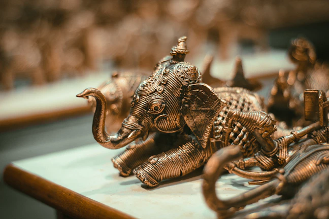 a close up of an elephant figurine on a table