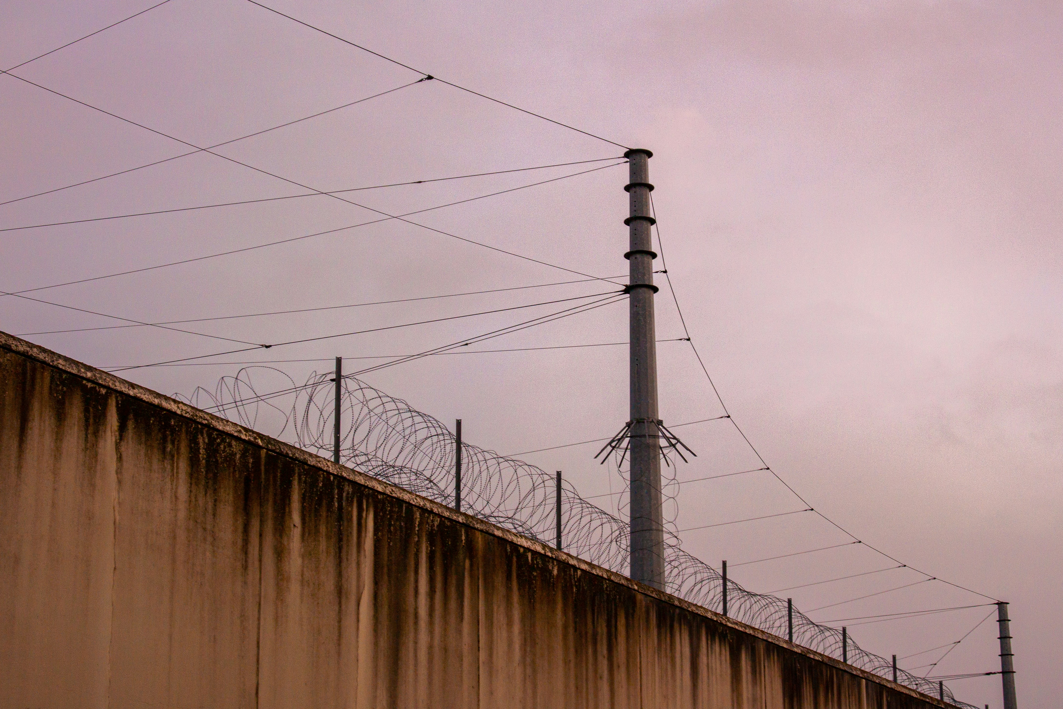a wall with barbed wire on top of it