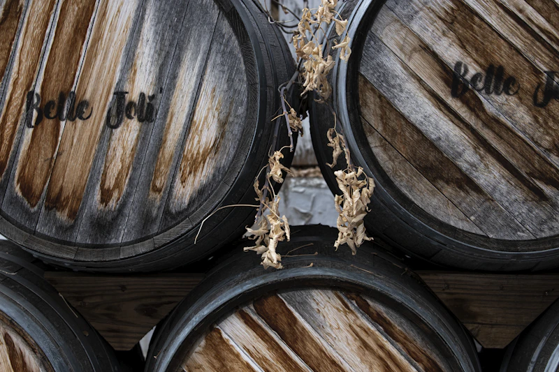 Stacked oak wine barrels in a cellar