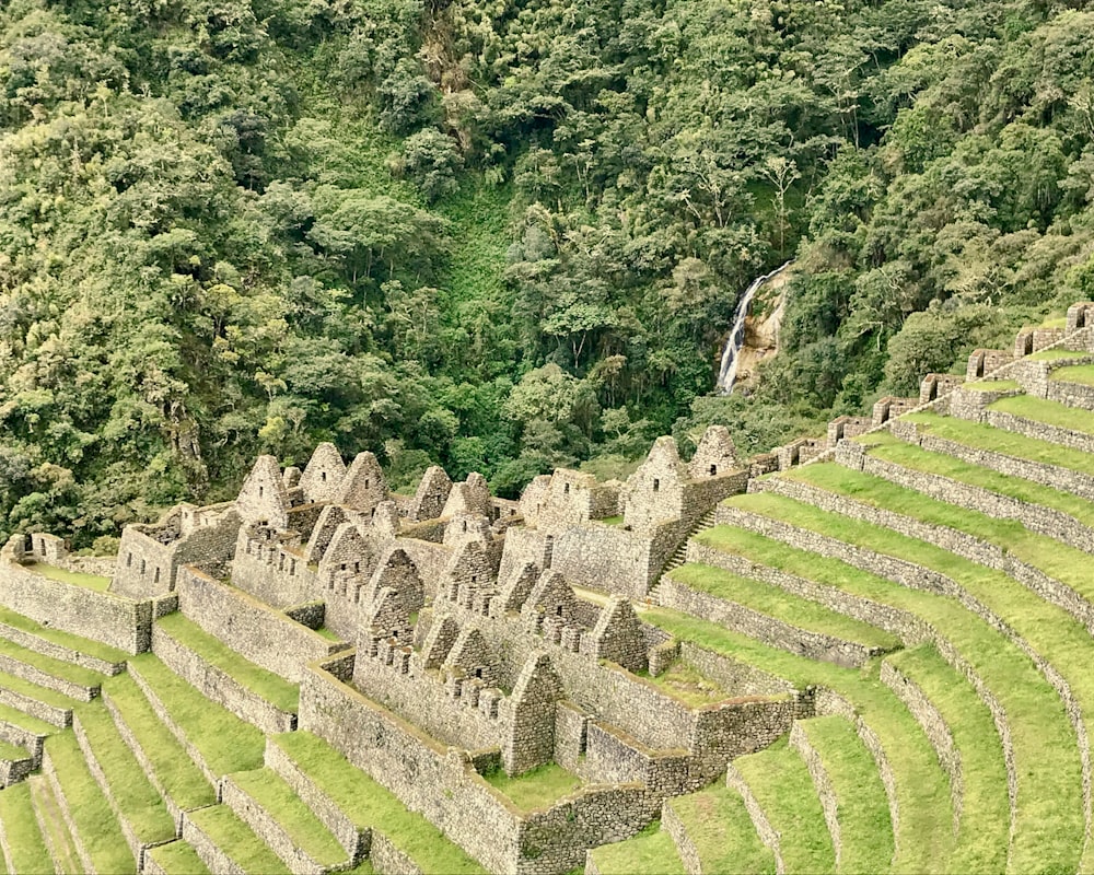 an aerial view of a large stone structure in the middle of a forest