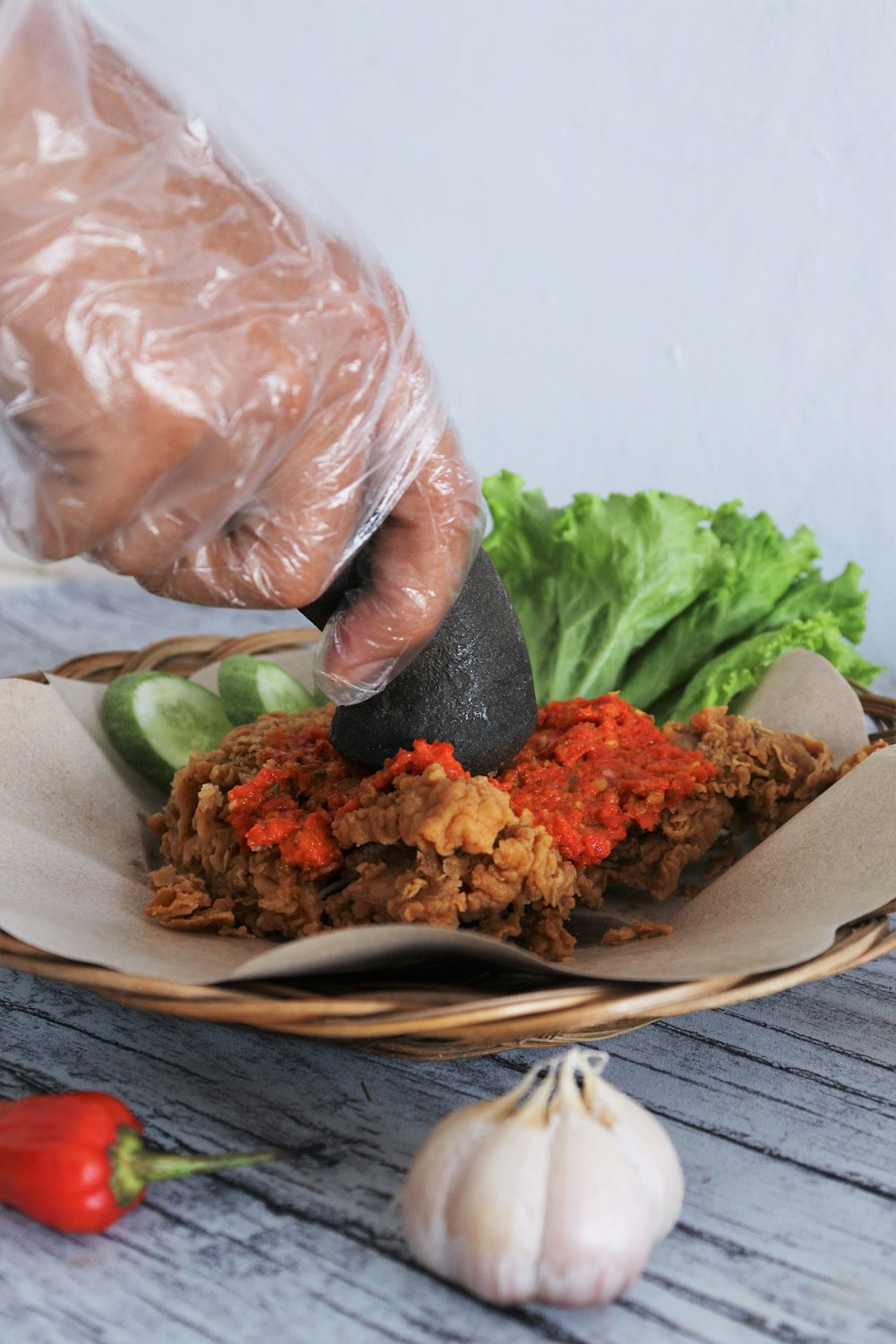 a person cutting food on a plate with a knife