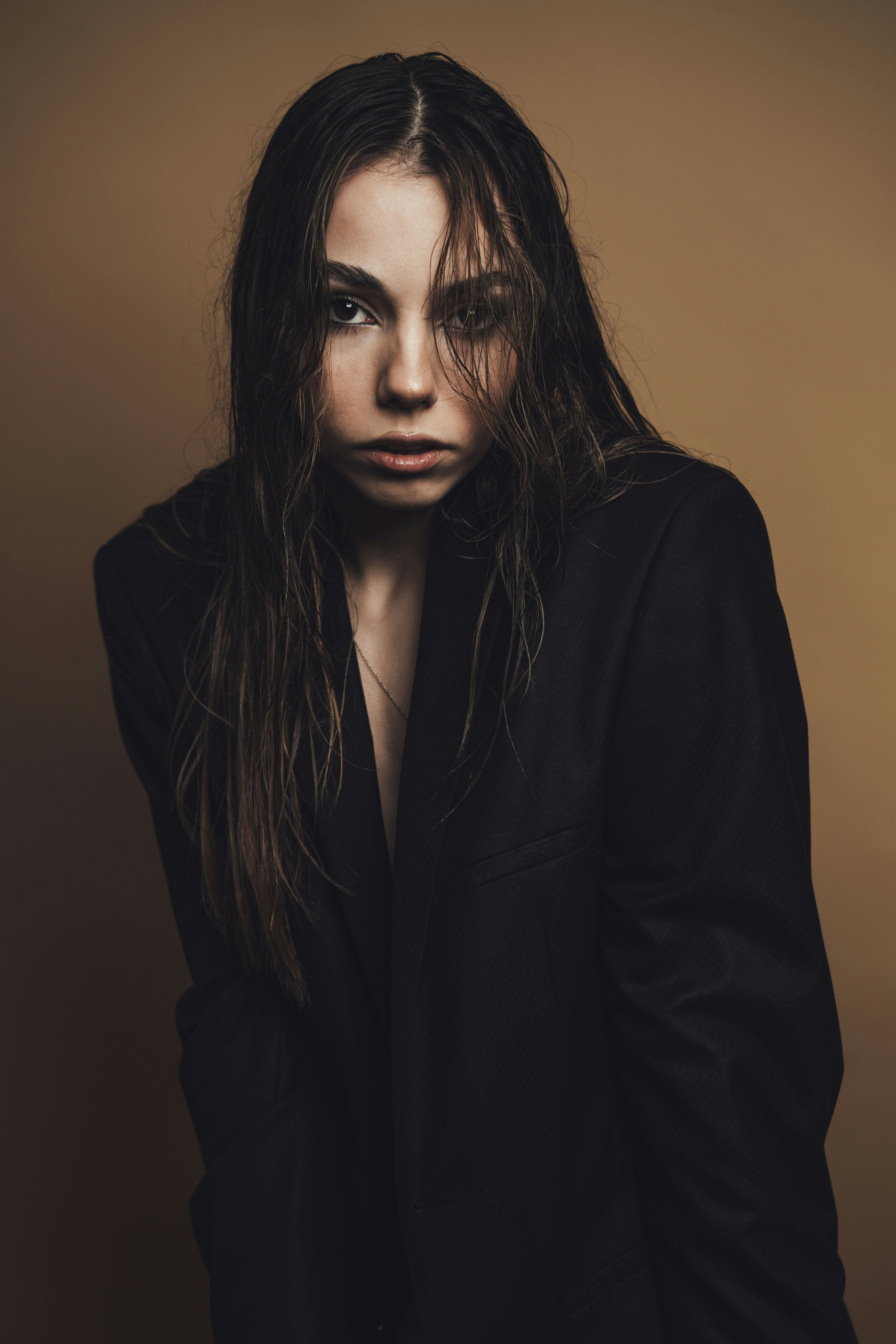 a woman with long hair posing for a picture