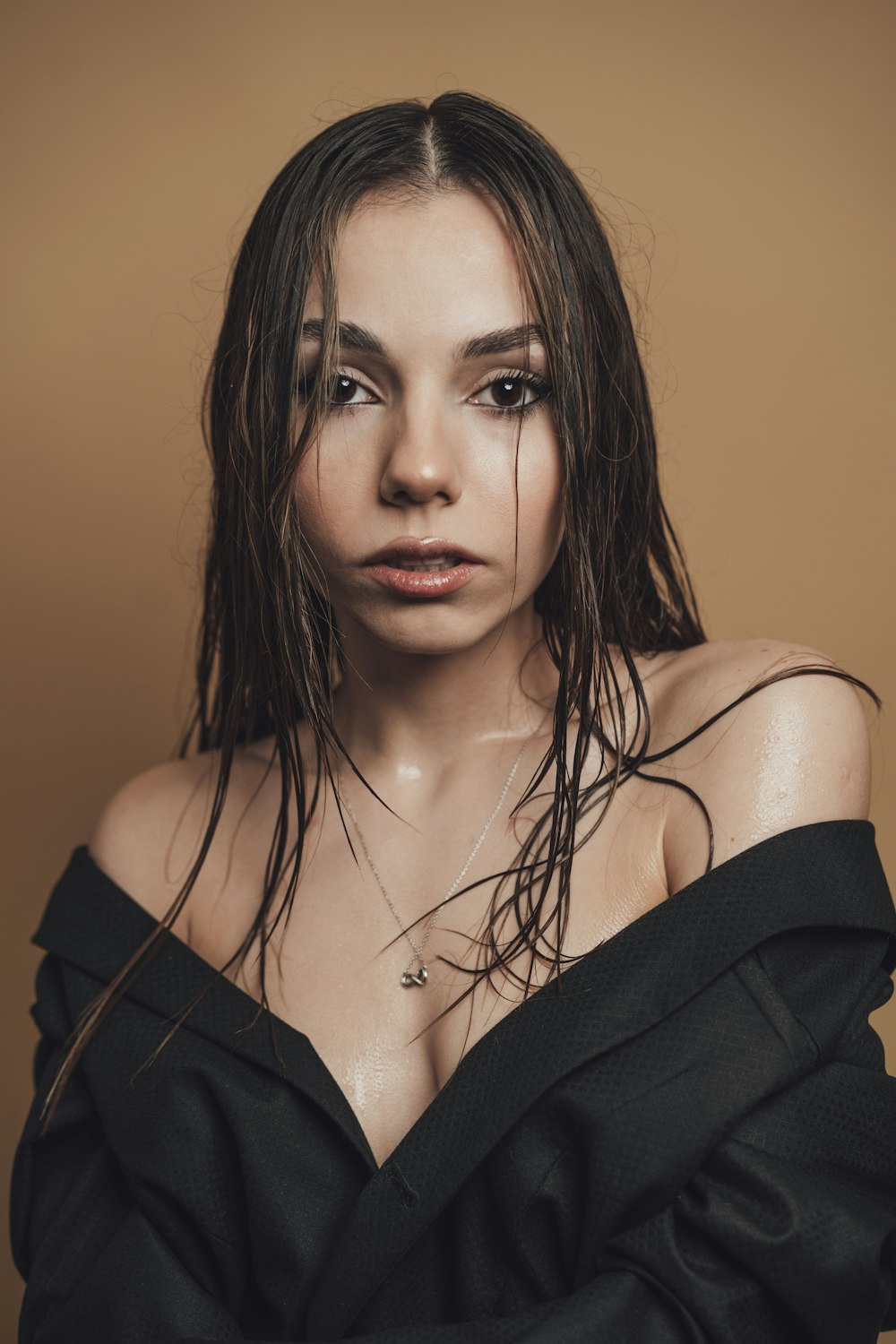 a woman with wet hair posing for a picture