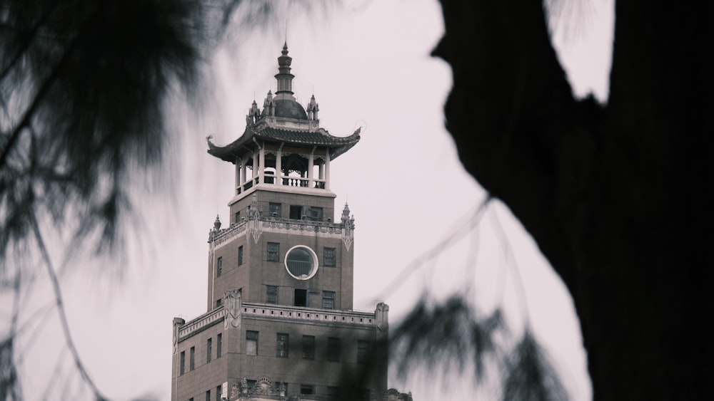 a tall building with a clock on the top of it