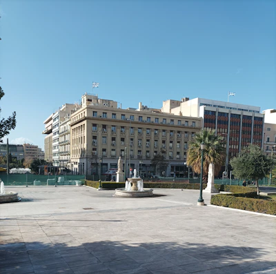 A serene cityscape showing iconic landmarks from both Spain and the UK under a clear sky.