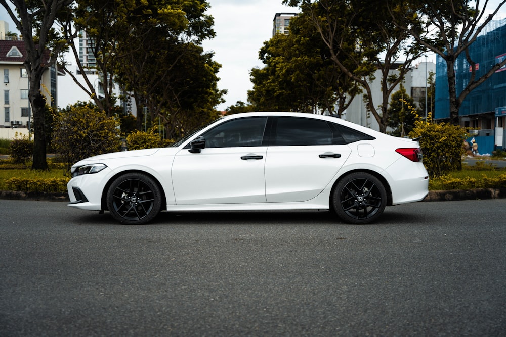 a white car parked on the side of the road