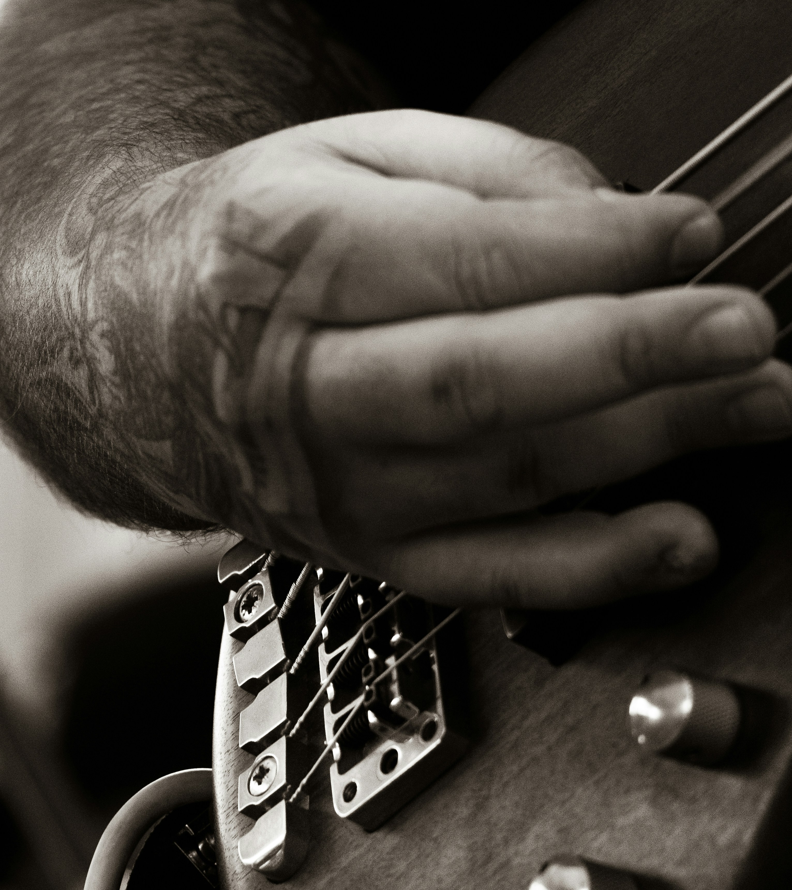 a close up of a person playing a guitar
