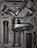 A professional camera stabilizer placed in a foam padded case, carefully arranged to fit the various components including the handle, gimbal, and accessories.