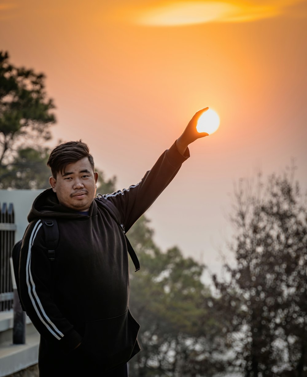 a man holding a frisbee in his right hand