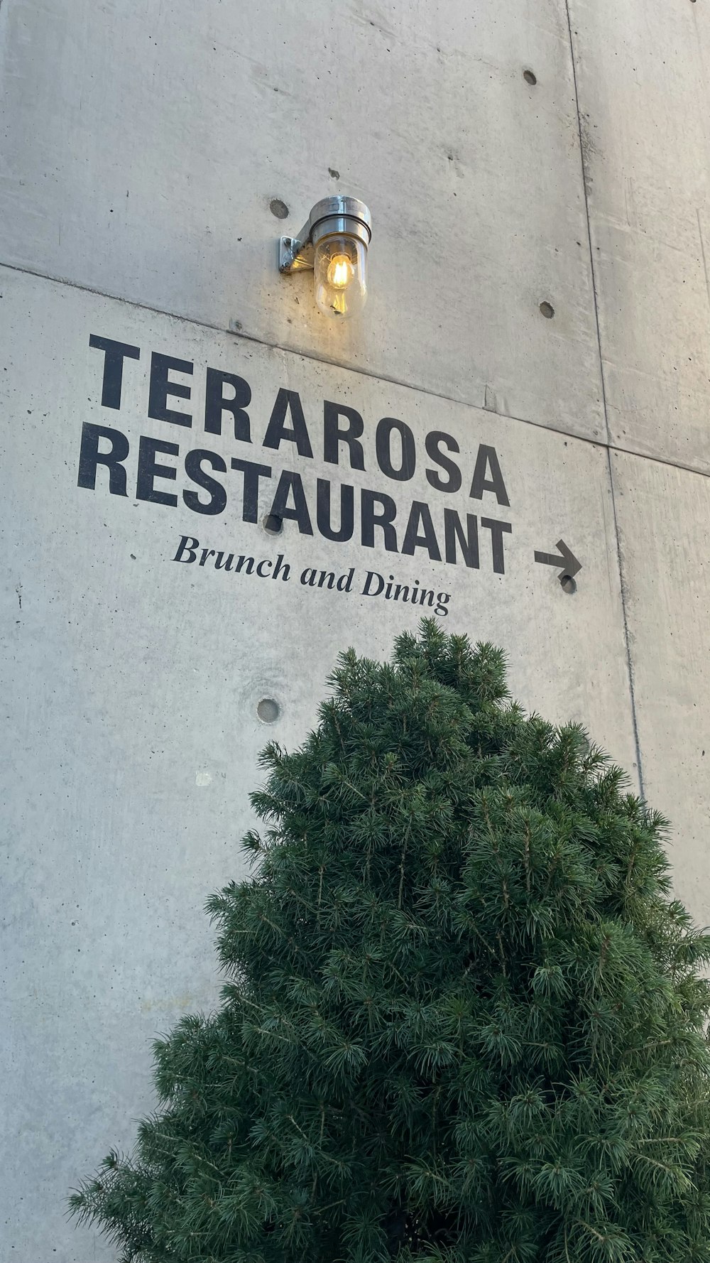 a sign on the side of a building that says terrarosa restaurant branch and