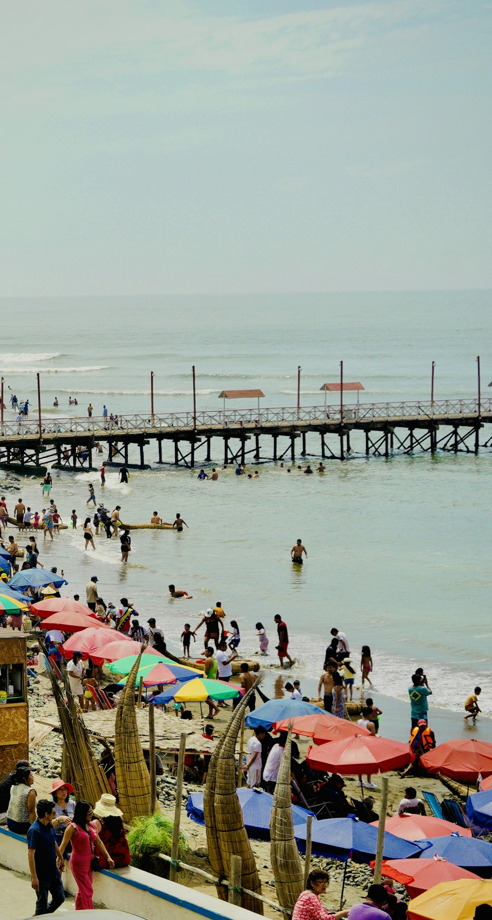 a crowded beach filled with lots of people