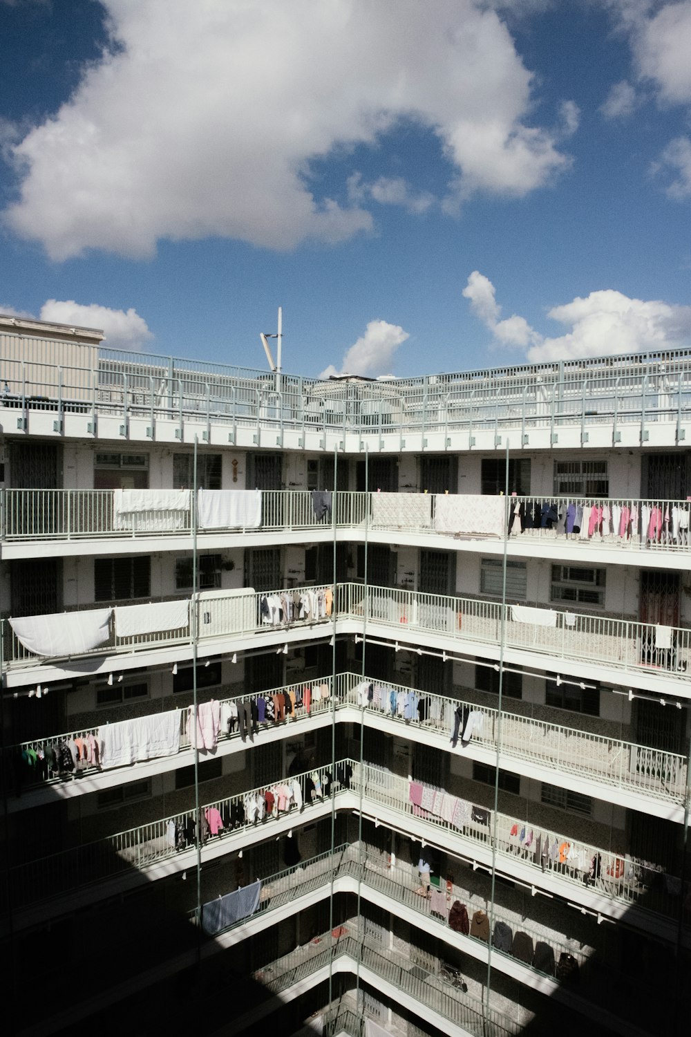 an apartment building with clothes hanging out to dry