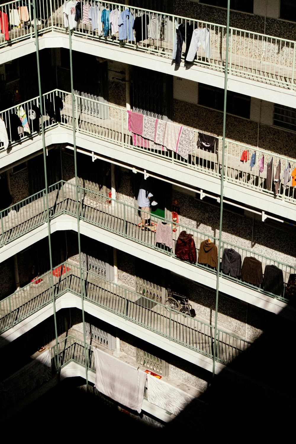 a building with clothes hanging on the balconies