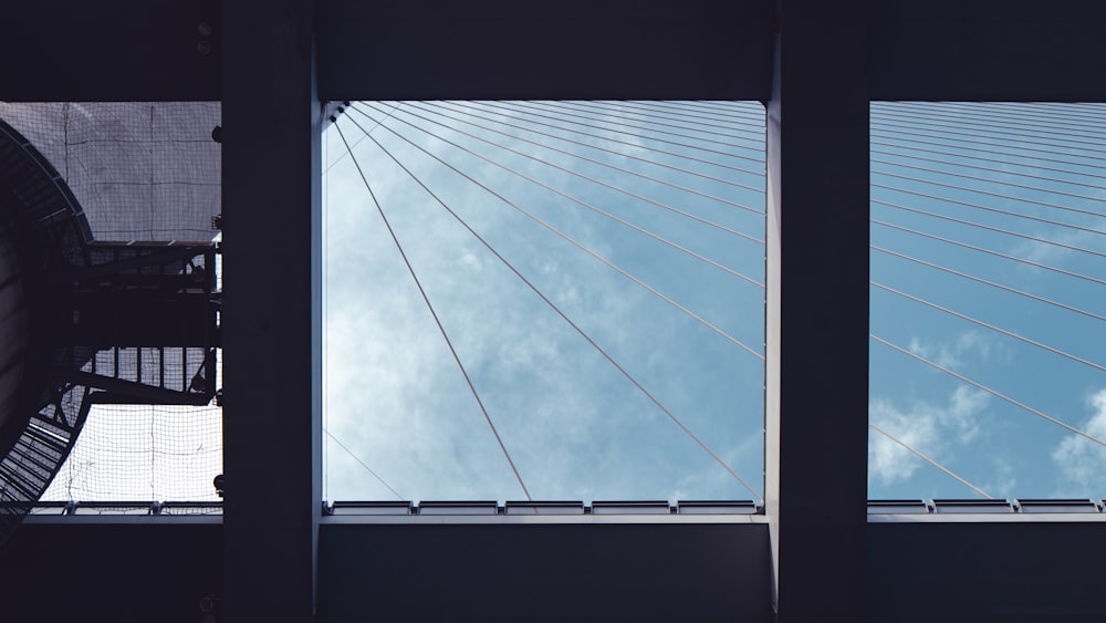 a view of a very tall bridge through a window