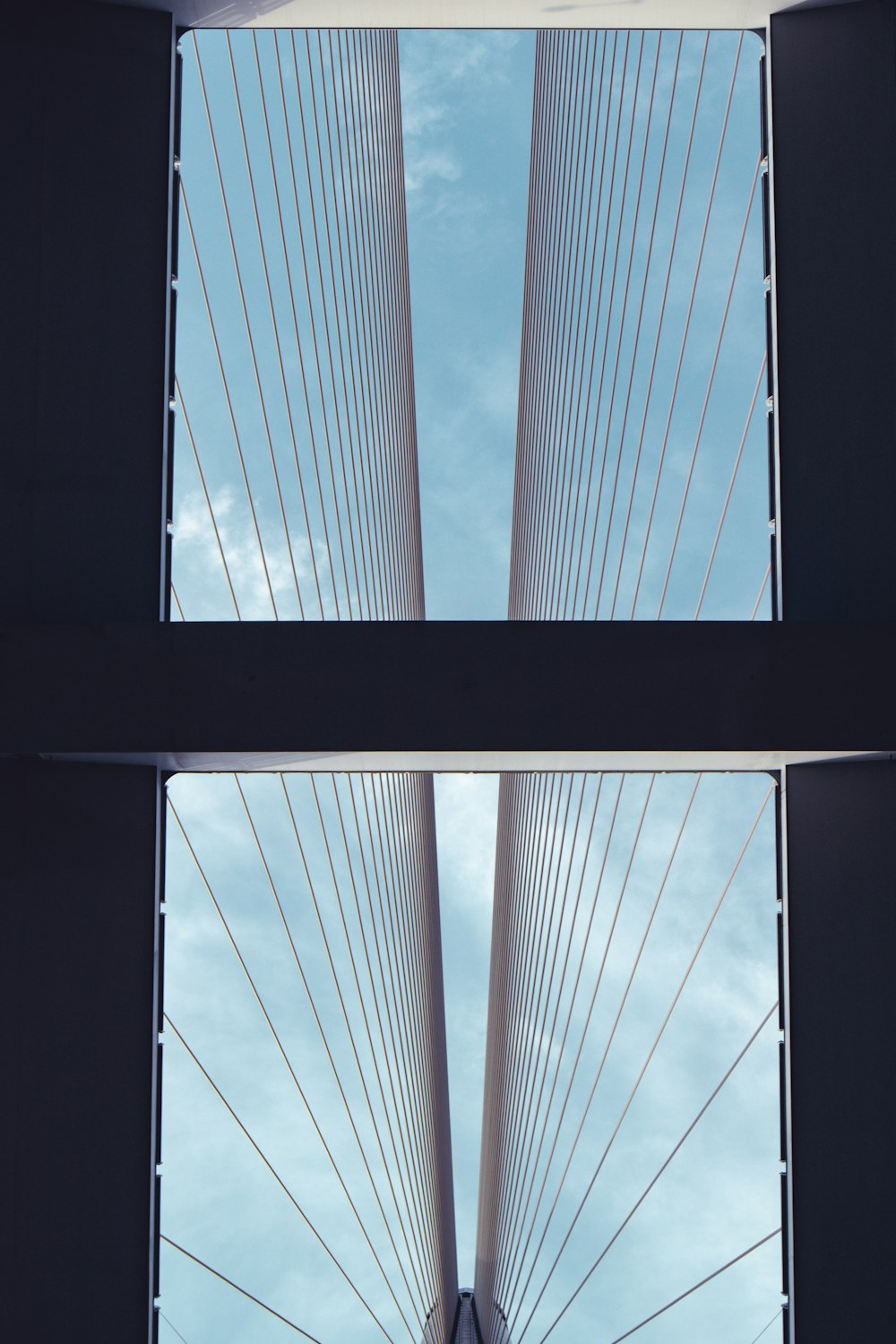 a view of the top of a bridge from below