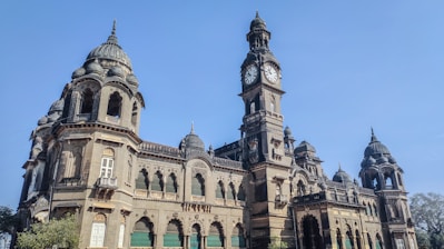 a large building with a clock on the top of it