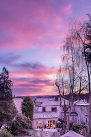 Completed family home with fresh paint and landscaped garden at sunset.
