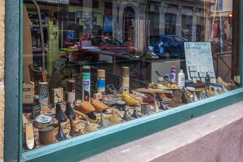 a store window with a variety of items in it