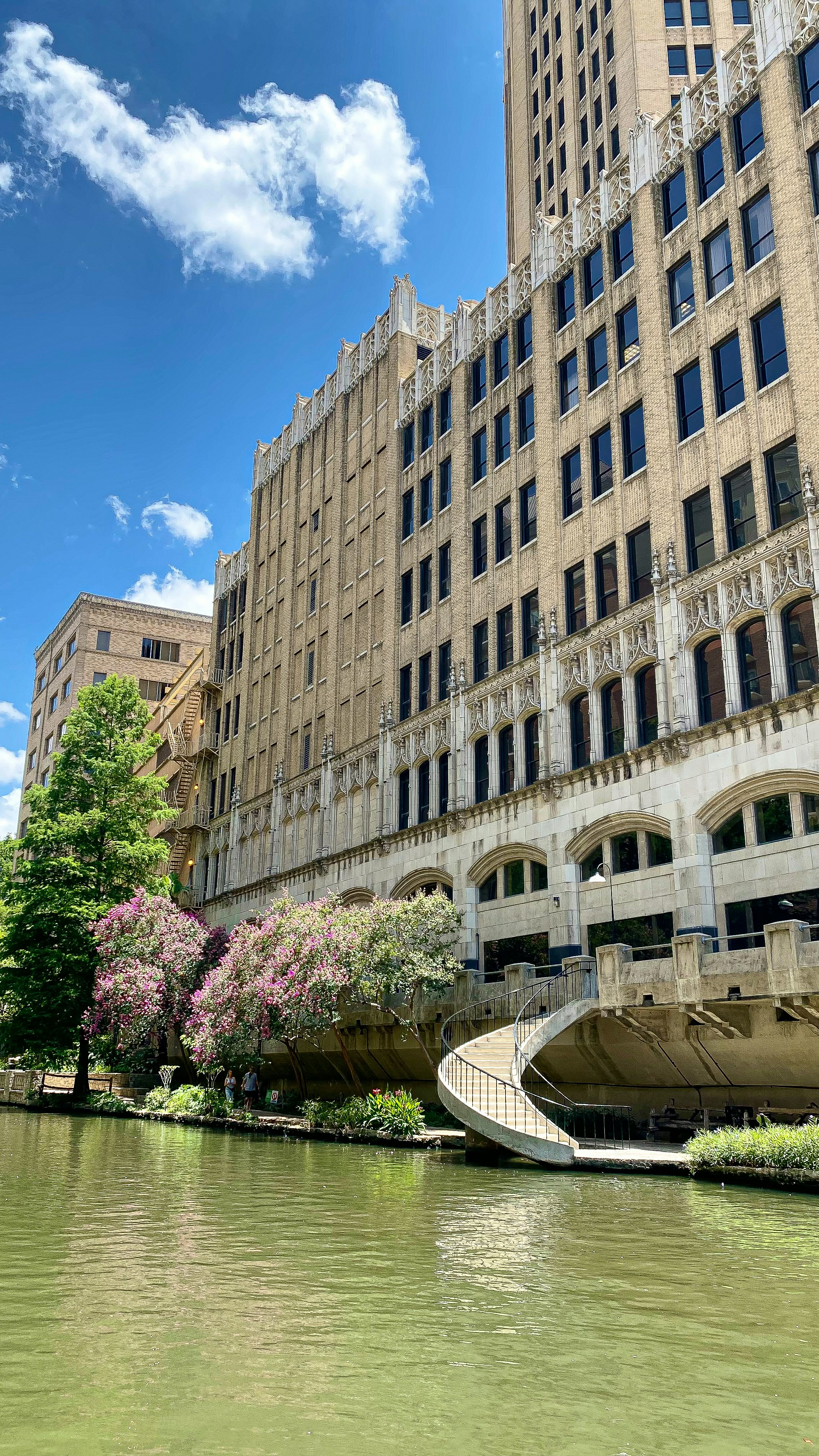 a large building sitting next to a body of water