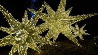 A bright shooting star light decoration illuminating an outdoor space