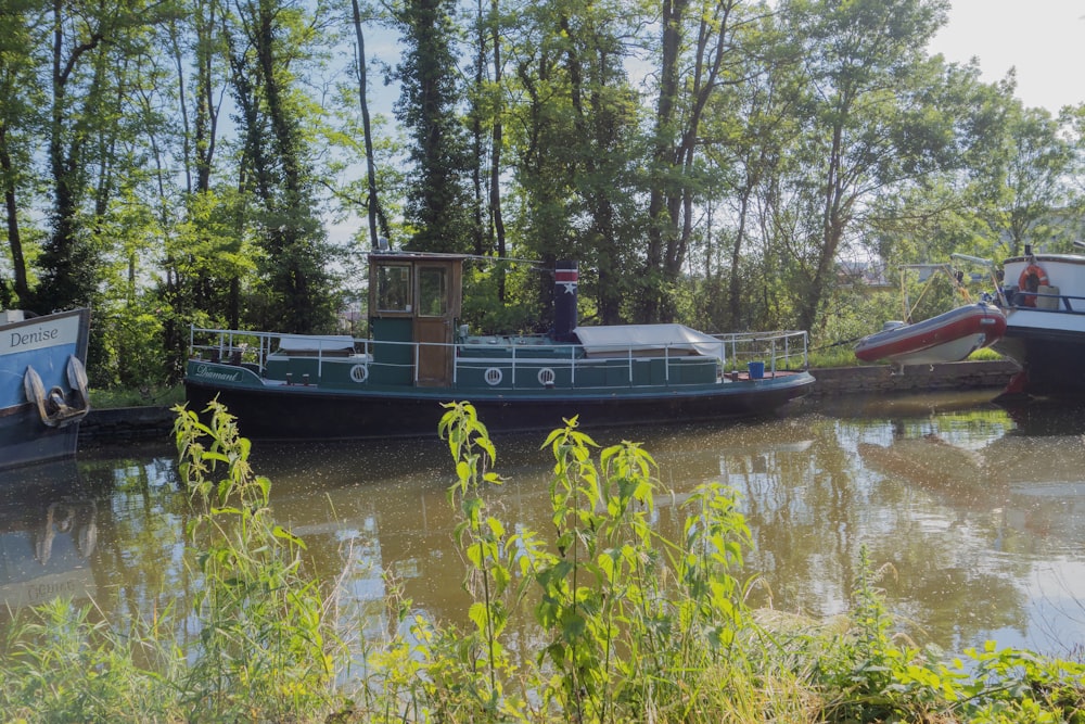 a couple of boats floating on top of a river