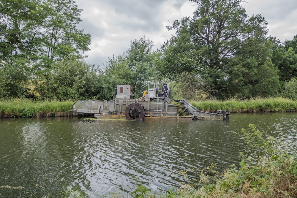 a boat is docked on the side of a river