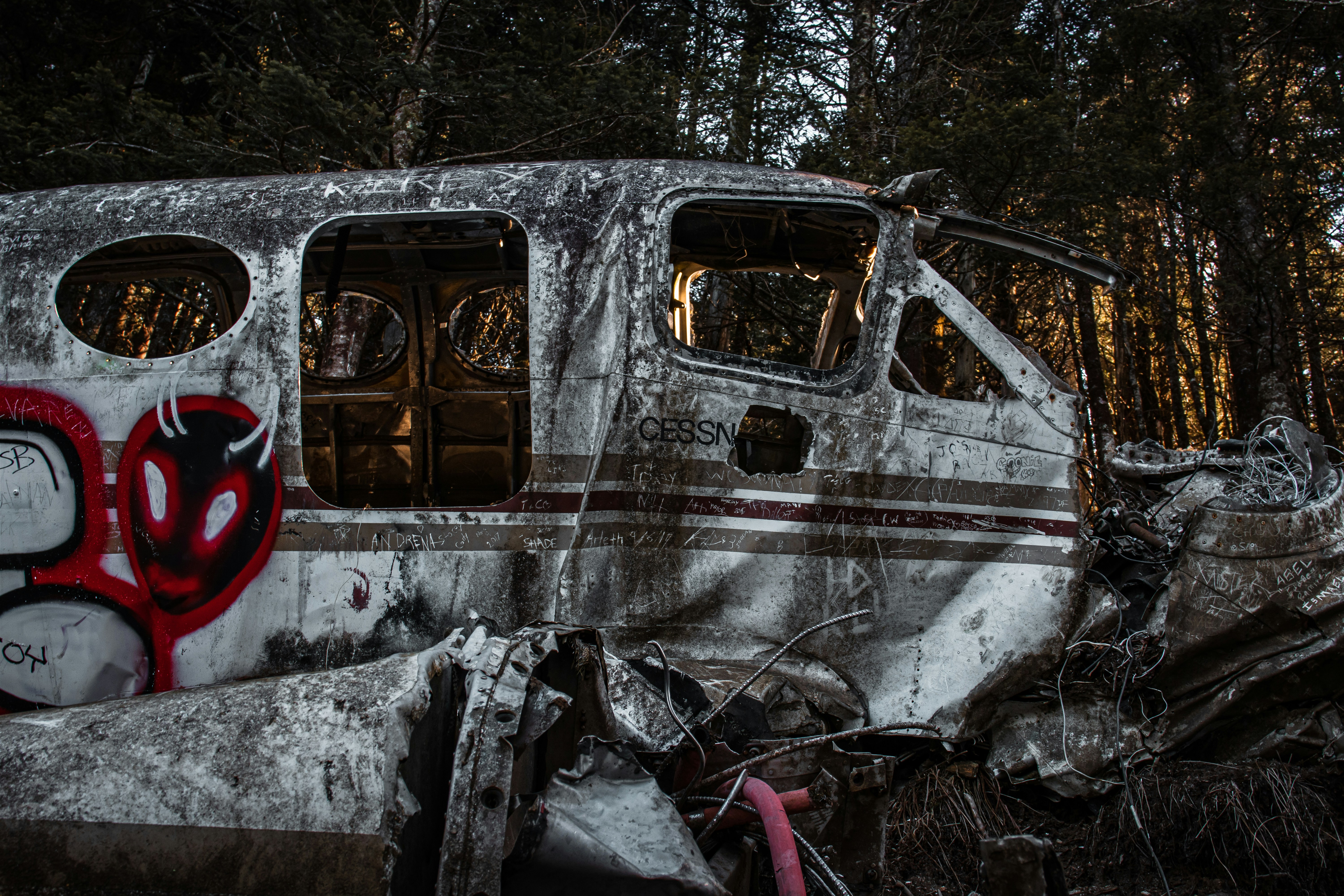 an old run down bus with graffiti on it