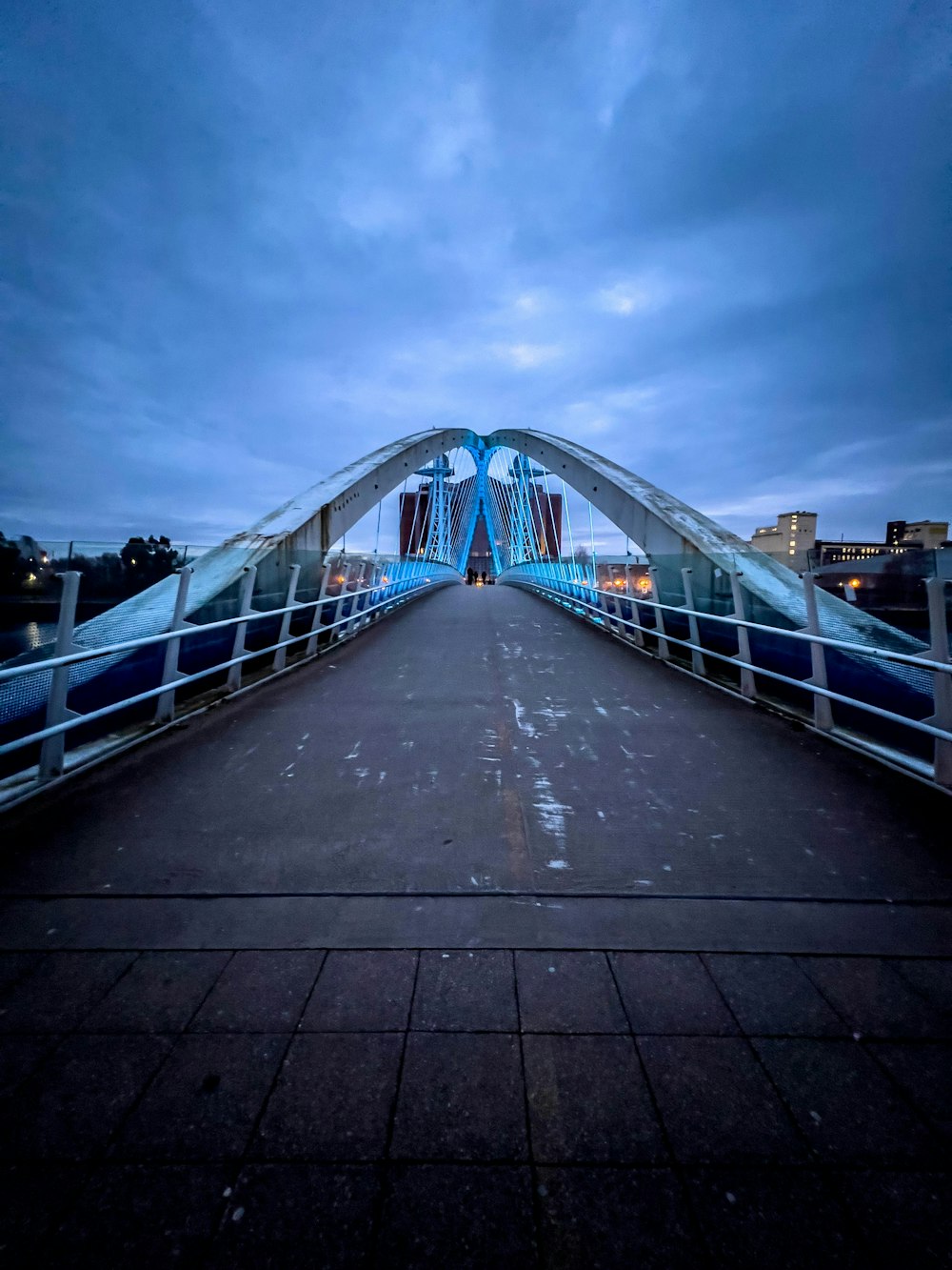 a bridge that has a sky line in the background