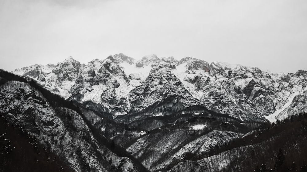 a black and white photo of a mountain range