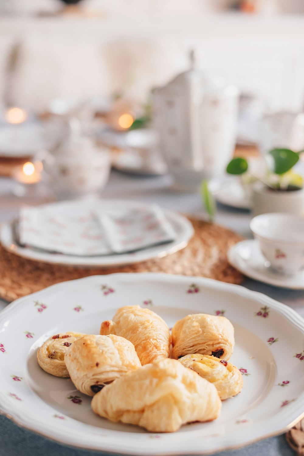 a white plate topped with pastries on top of a table