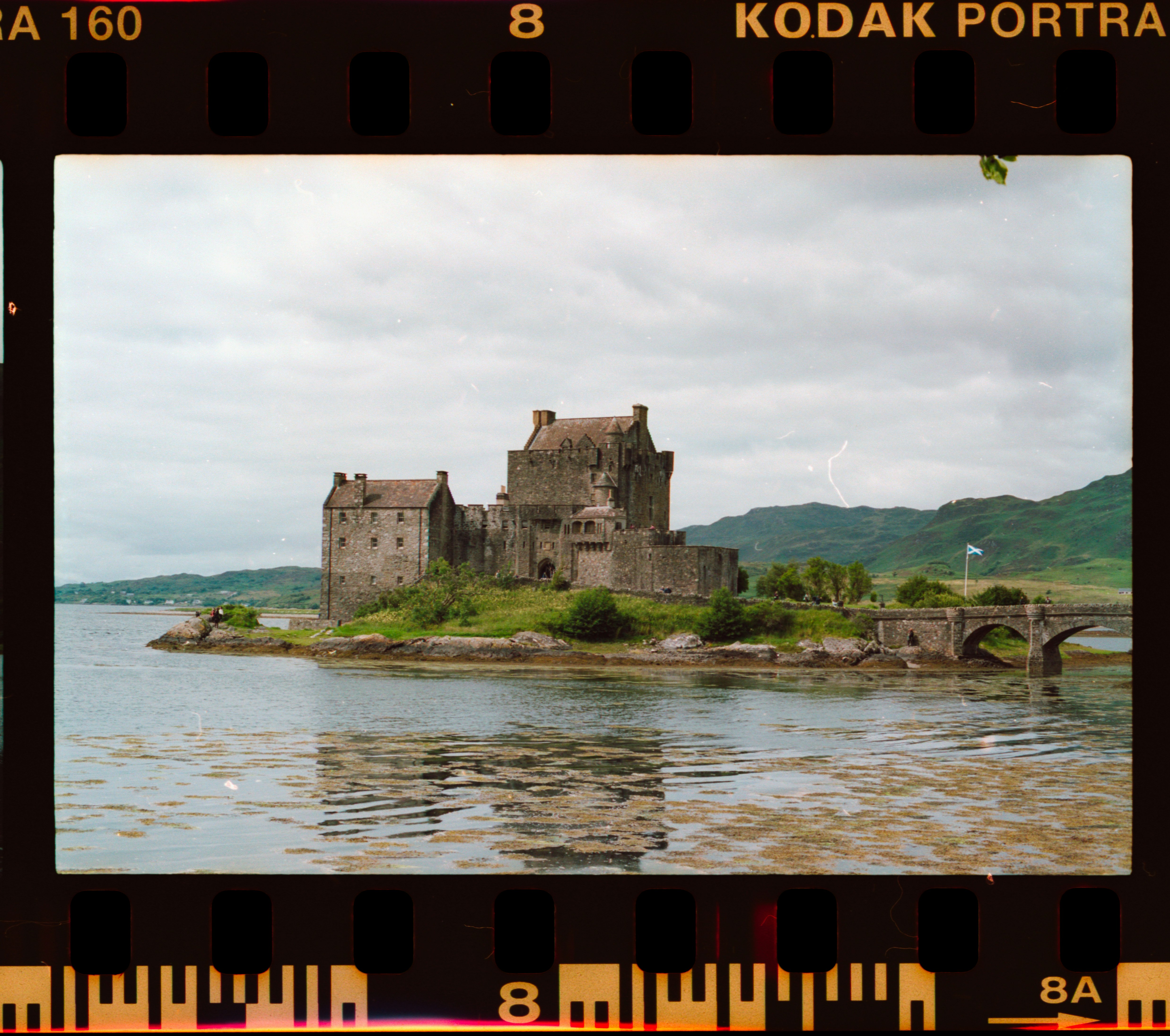 a picture of a castle on a small island
