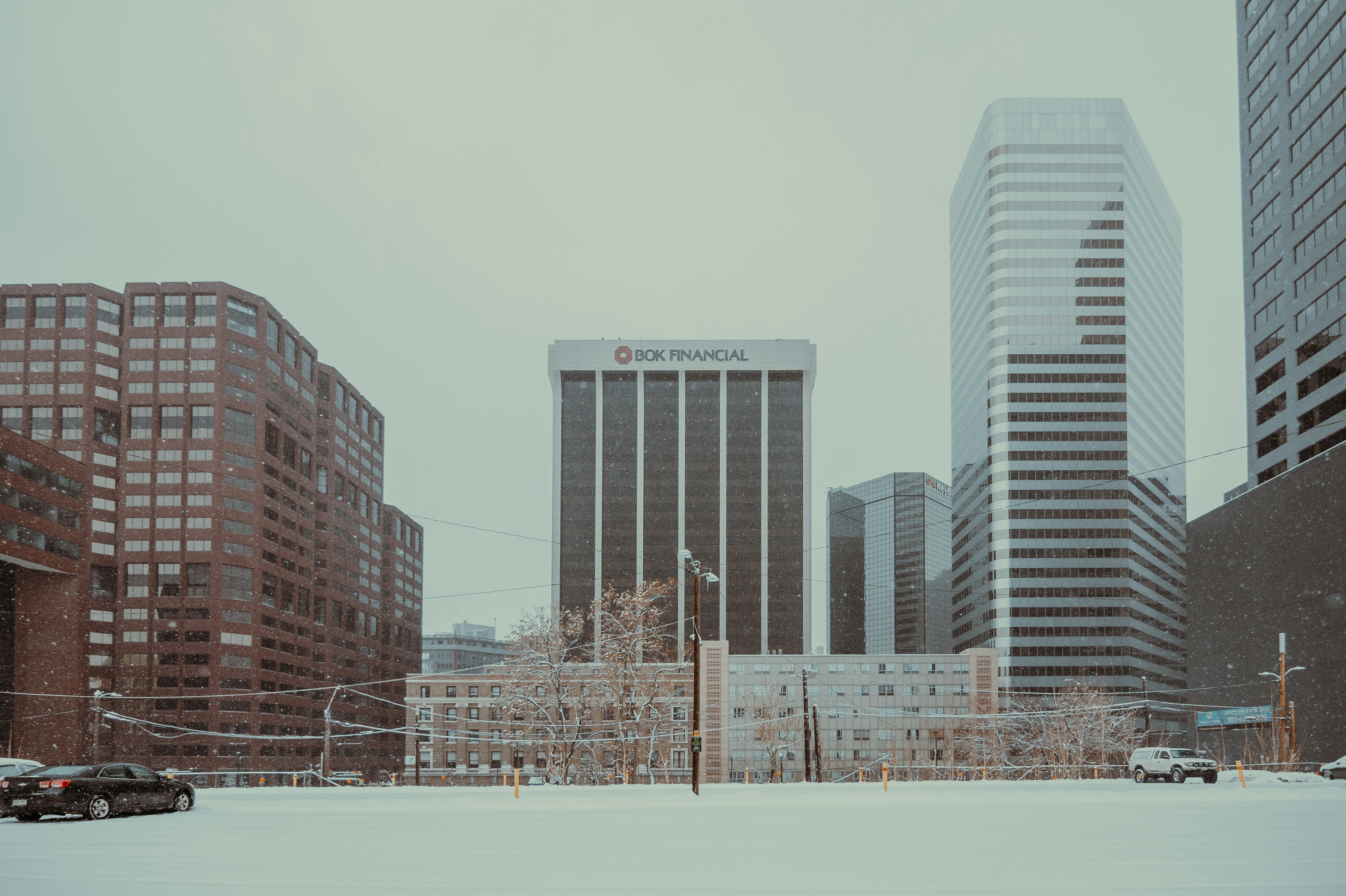 Snowy city with tall buildings