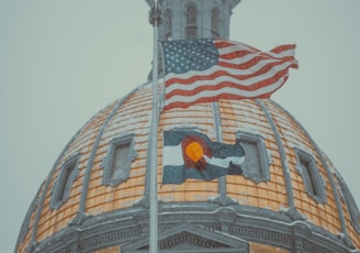 a large dome with a flag on top of it