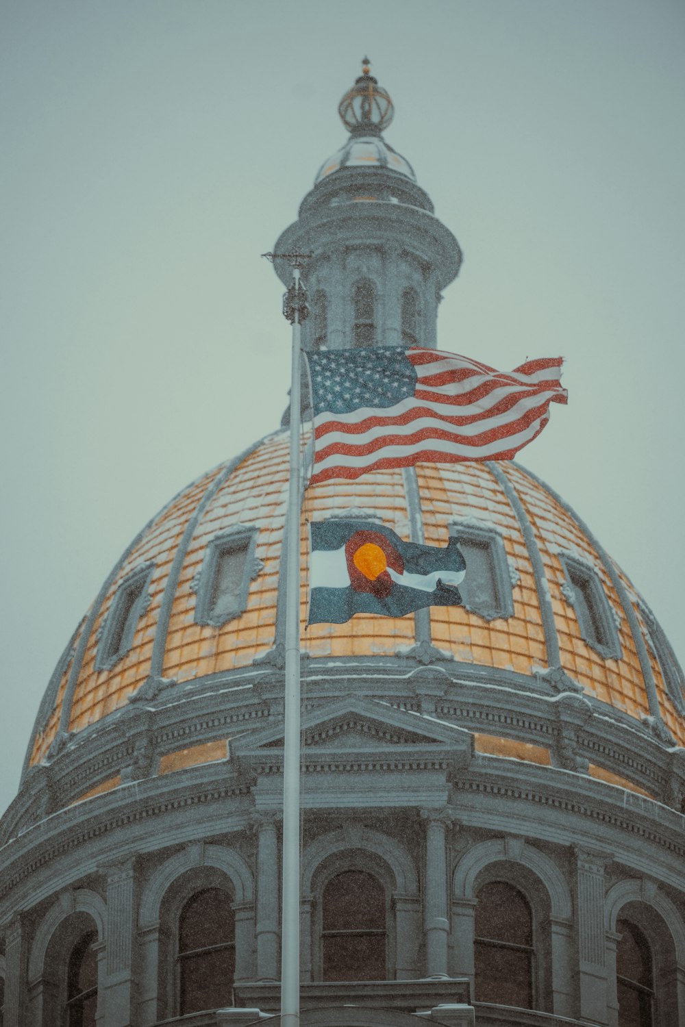 a large dome with a flag on top of it