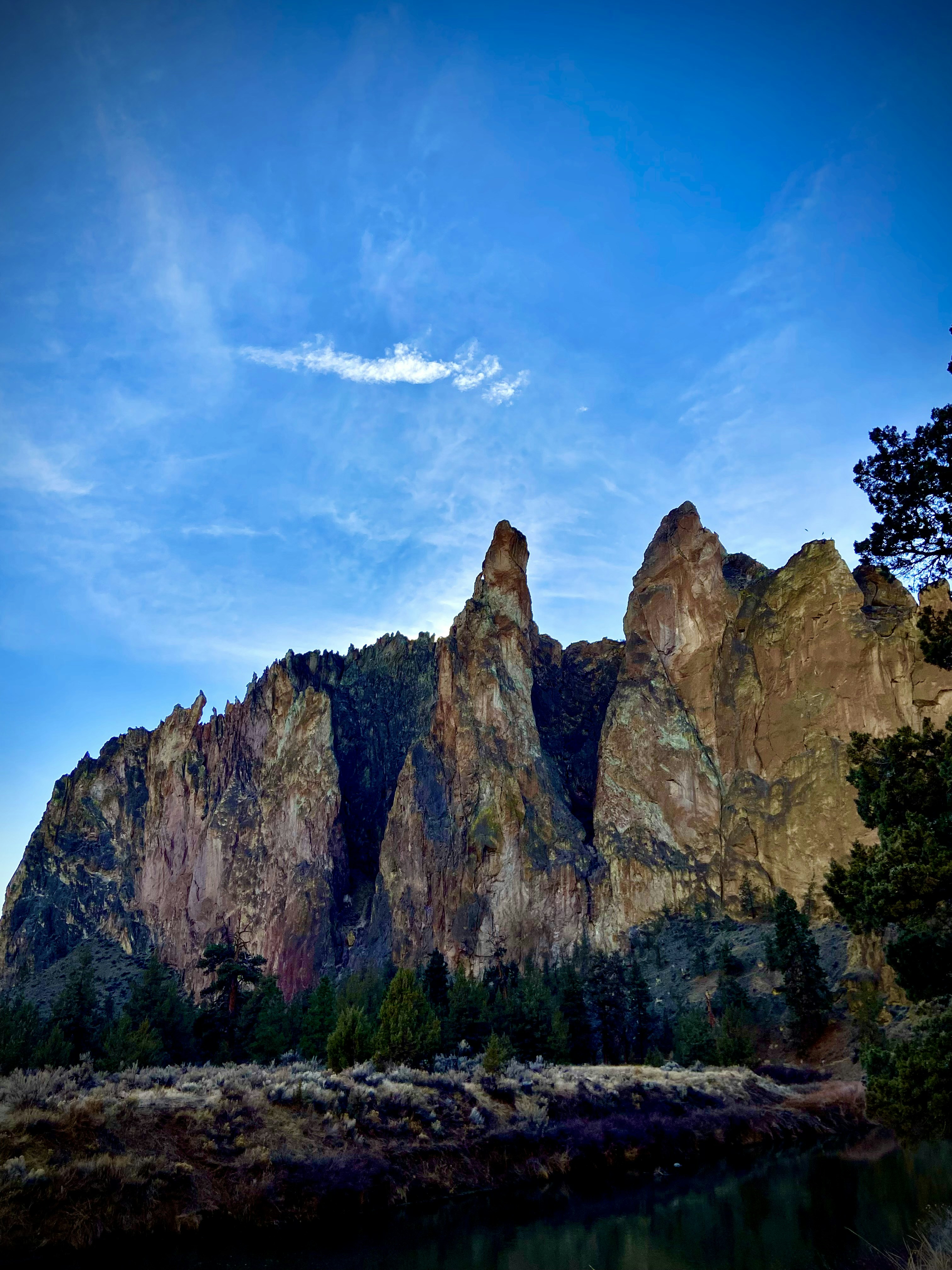 a mountain range with a body of water in front of it