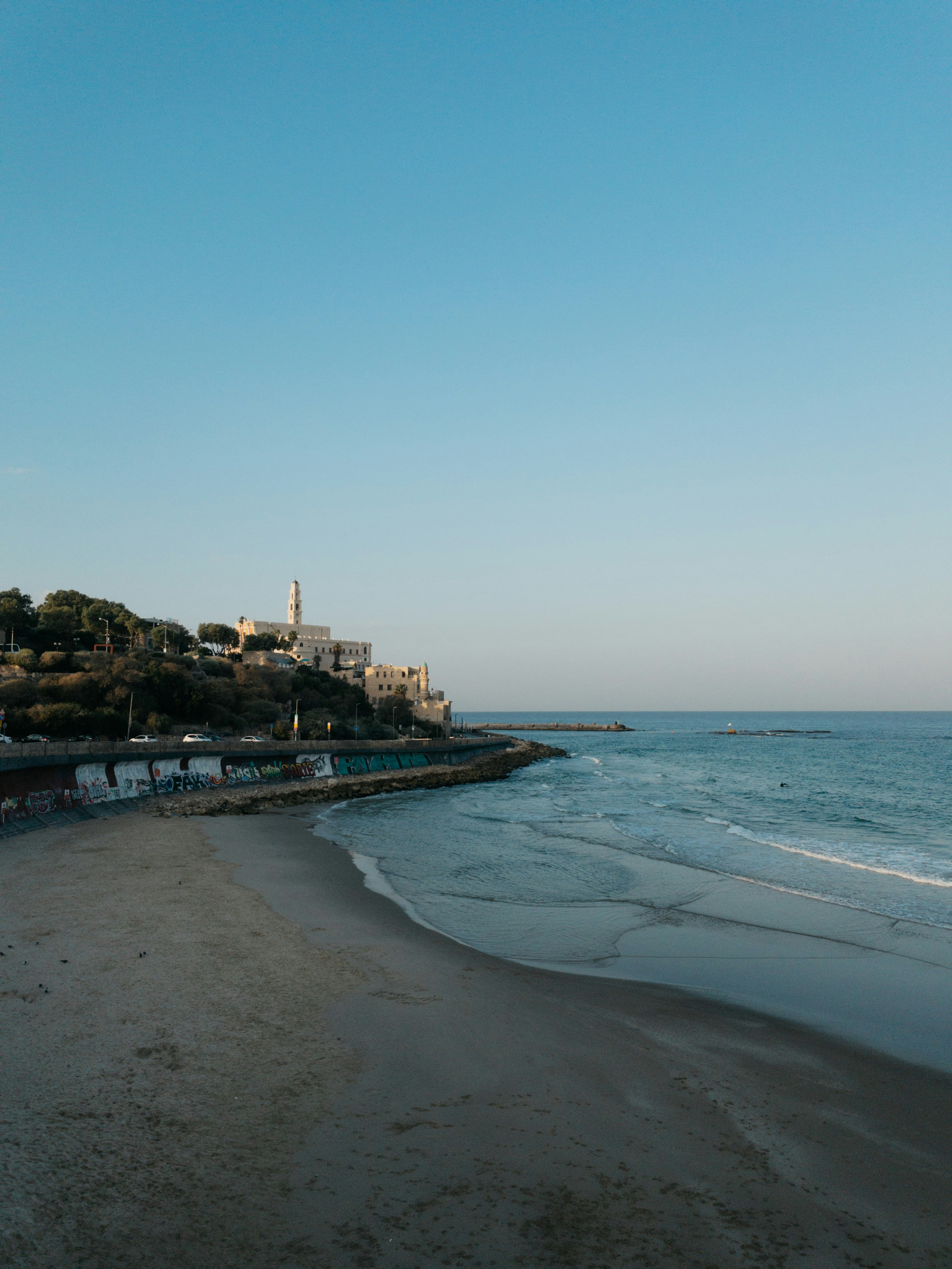 a view of a beach from the shore